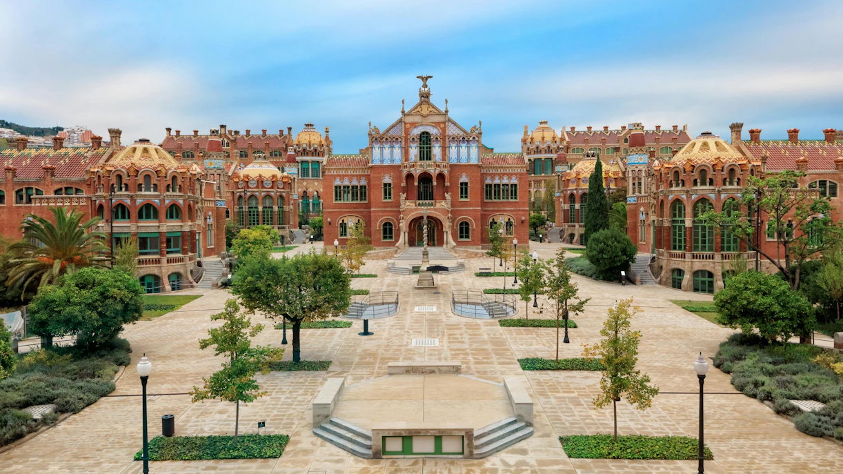 Hospital de la Santa Creu i Sant Pau complex with ornate architecture and garden in Barcelona.
