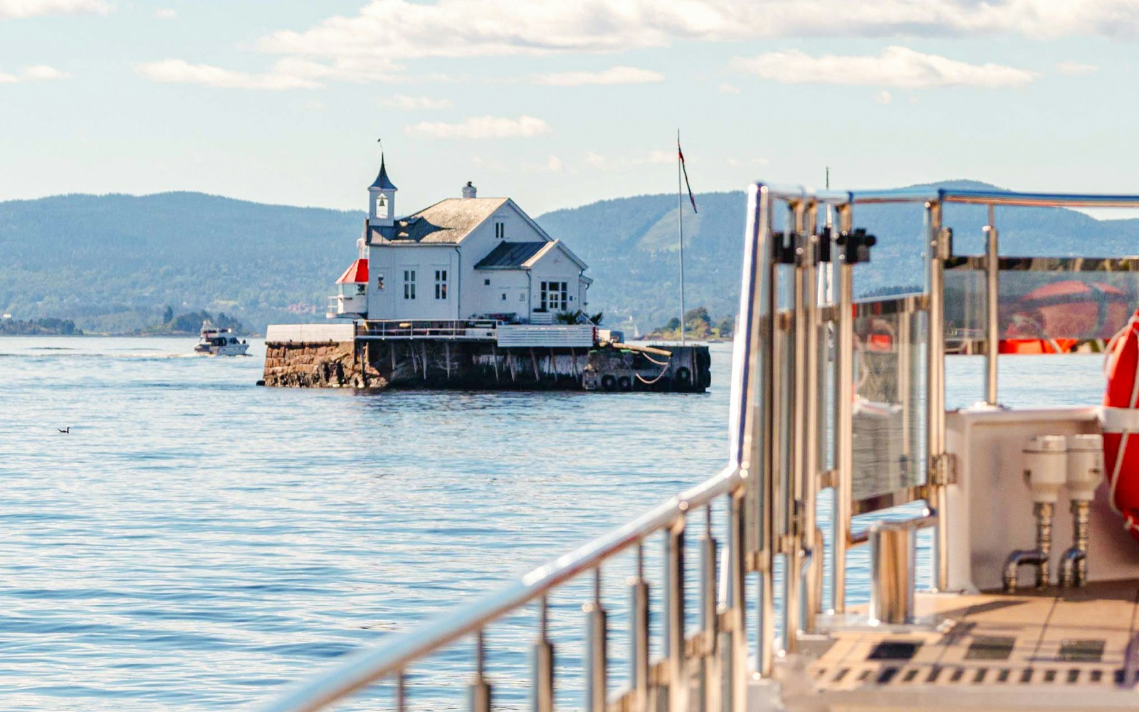 Silent fjord cruise from Oslo with guide, showcasing serene waters and scenic landscapes.