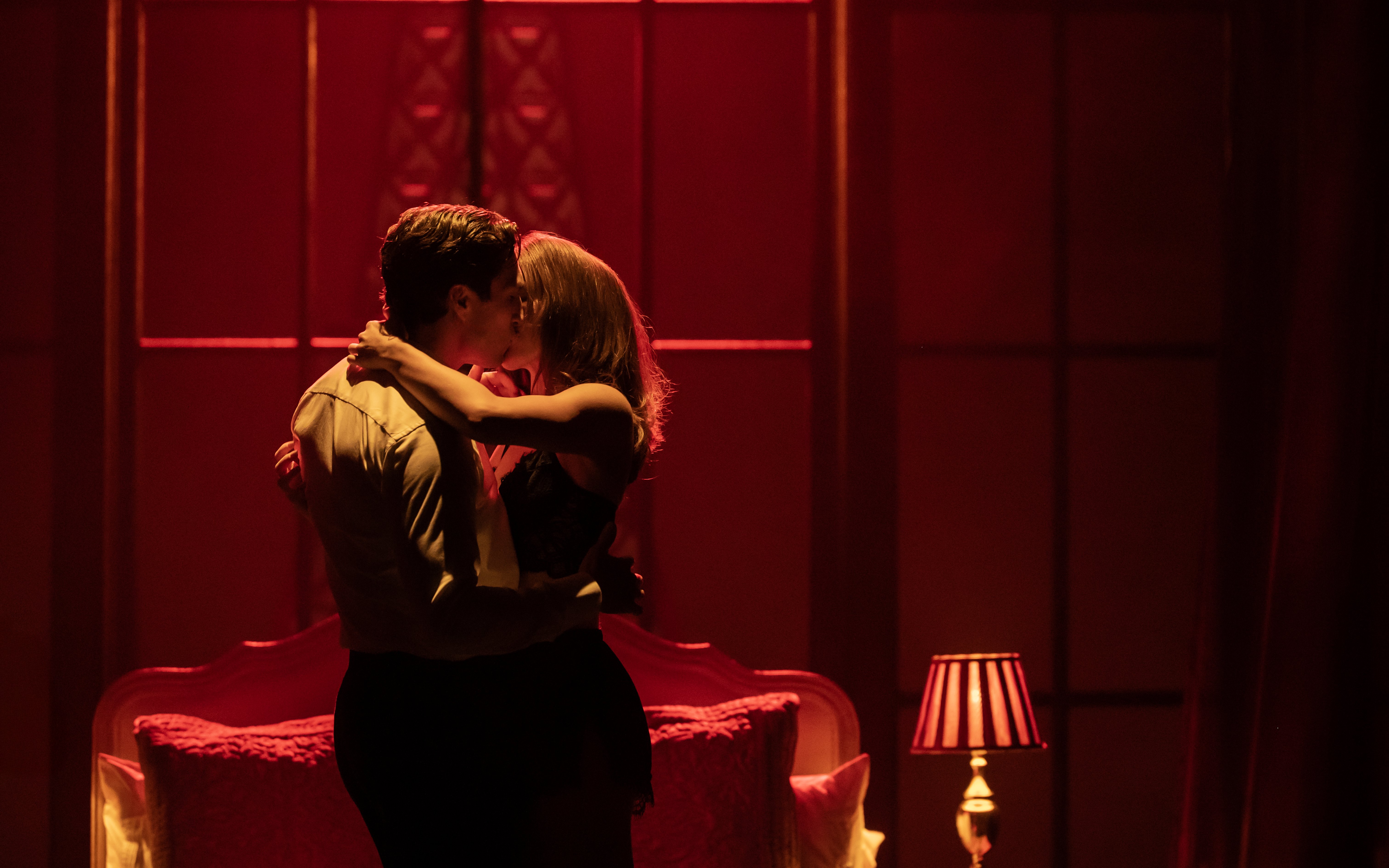 Couple embracing on stage during The Devil Wears Prada Westend show.