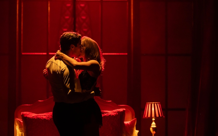 Couple embracing on stage during The Devil Wears Prada Westend show.