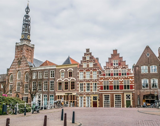 Historic buildings and church tower in Leiden, Netherlands.
