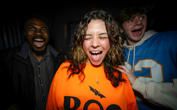 Guests reacting in Halloween Haunt zones at Dorney Park.