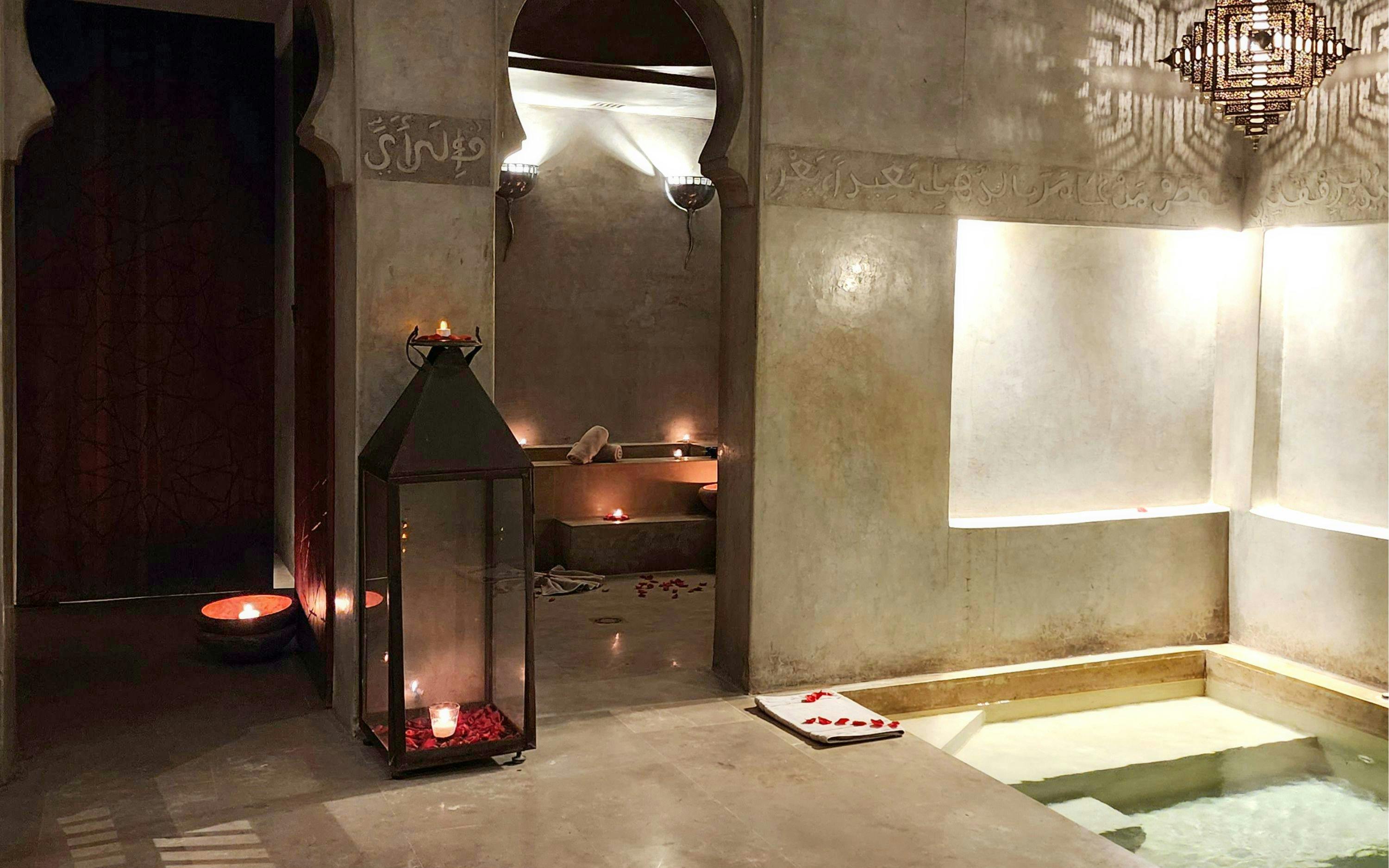 Le Bain Bleu Hammam & Spa interior with candles and pool, Marrakesh.