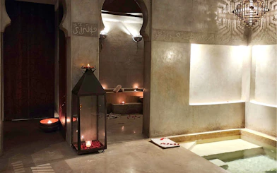 Le Bain Bleu Hammam & Spa interior with candles and pool, Marrakesh.