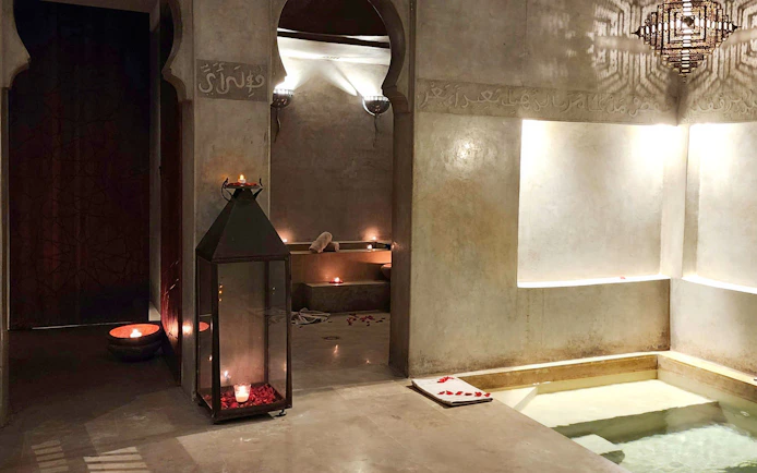 Le Bain Bleu Hammam & Spa interior with candles and pool, Marrakesh.