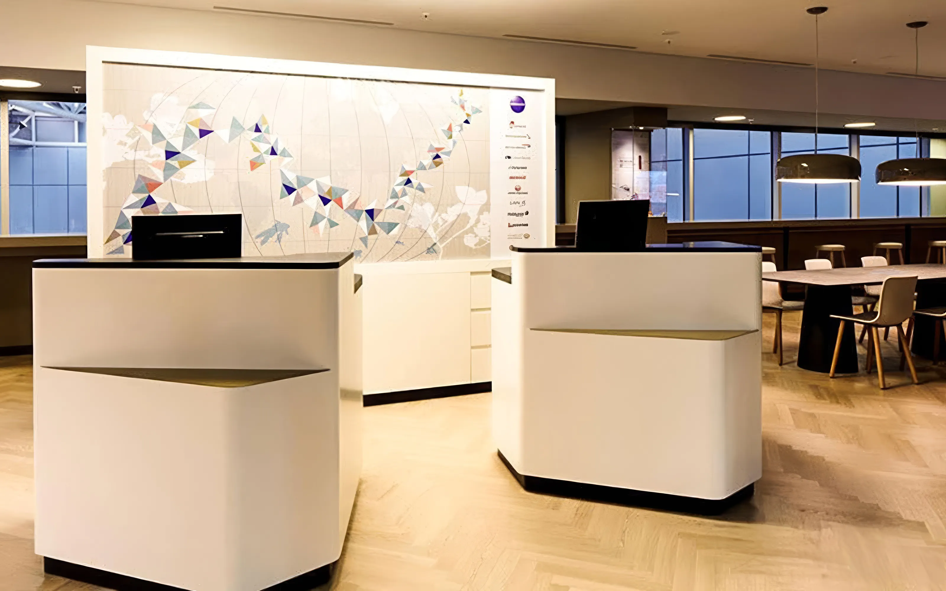 Reception area of Aspire ONE Lounge at Zurich Airport, featuring modern decor and seating.