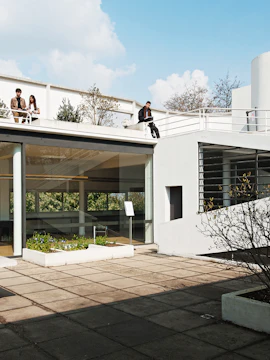 Villa Savoye rooftop terrace with visitors, Poissy, France.