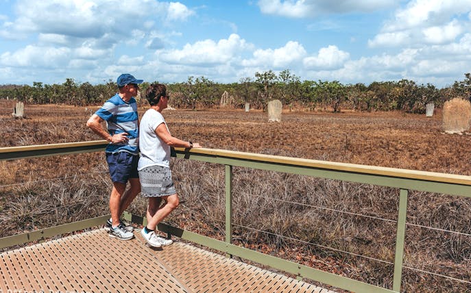 Visitors observing termite mounds at Litchfield National Park, Australia.
