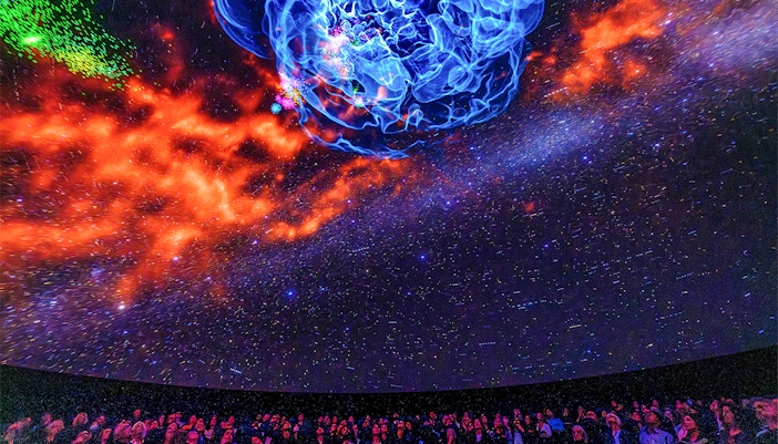 Visitors exploring the Encounters in the Milky Way exhibit at the American Museum of Natural History.