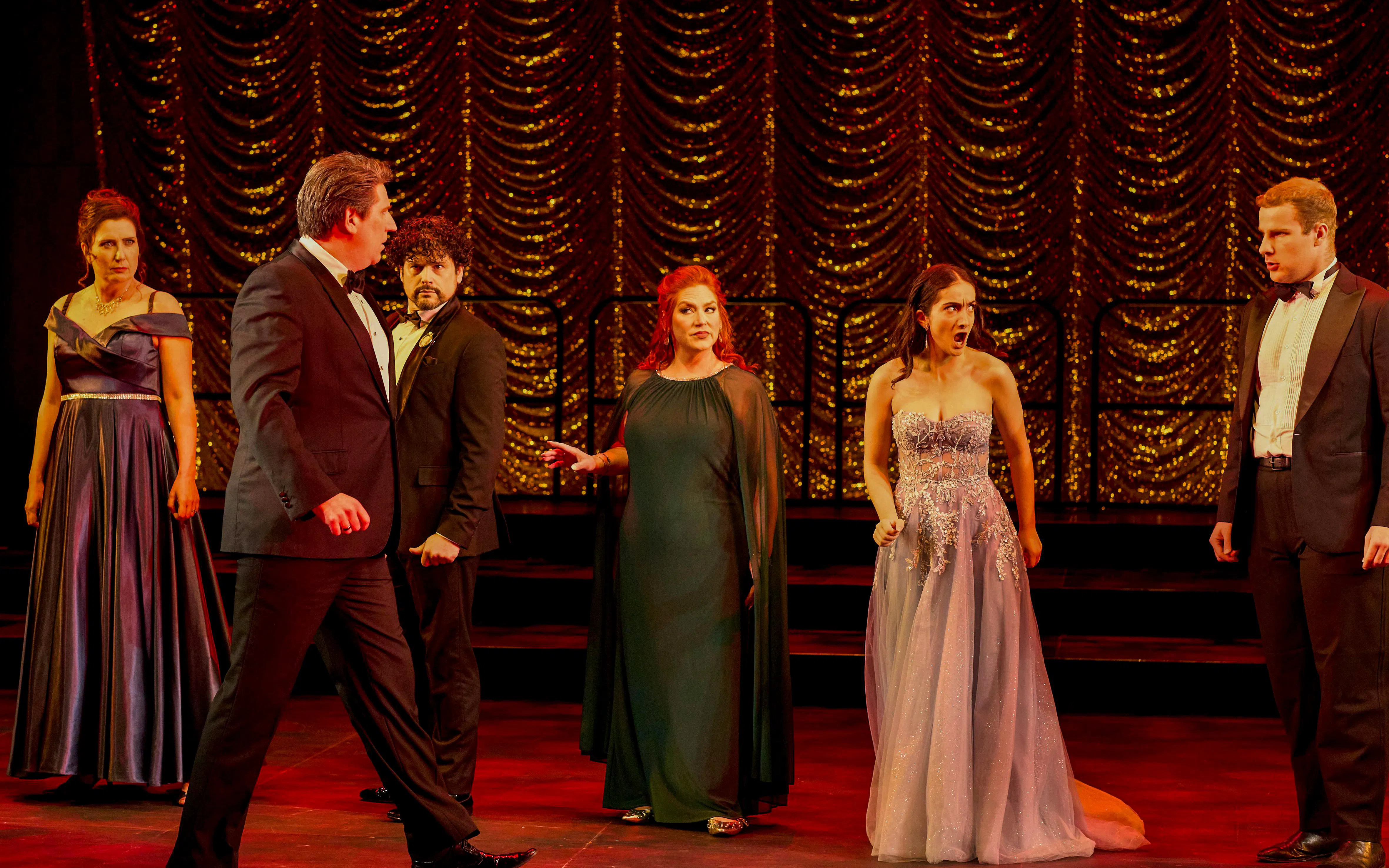 Cast performing a scene from "My Fair Lady" on stage with ornate backdrop.
