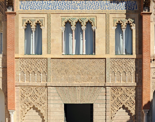 Palacio del Rey Don Pedro courtyard with intricate arches, Alcazar Seville.