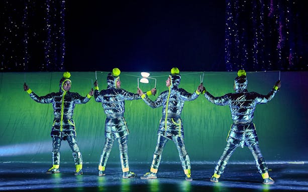 Performers in metallic costumes during Cirque du Soleil's 'Twas The Night Before stage show.