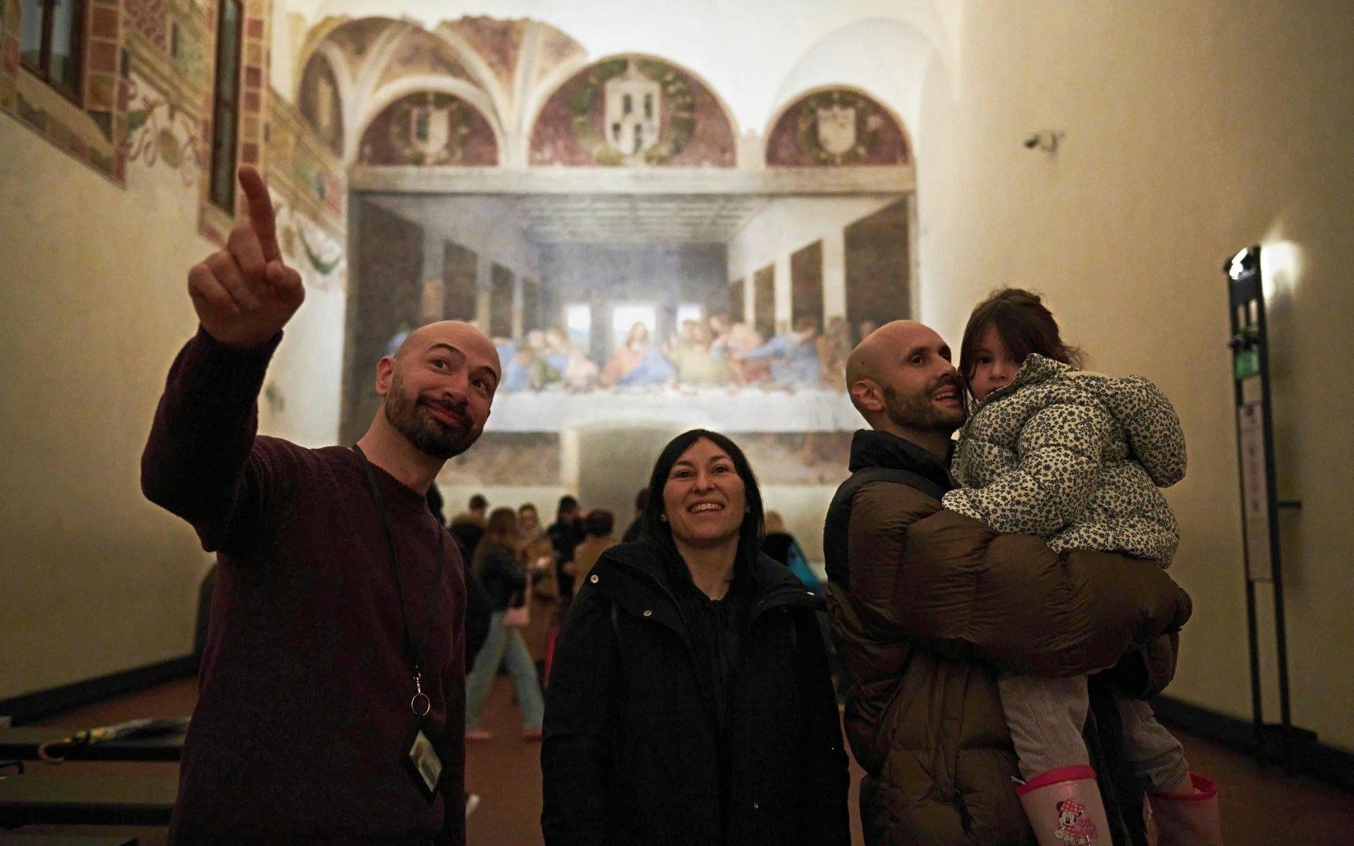 Visitors at Milan's Last Supper museum viewing the famous mural.