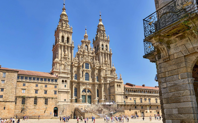Santiago De Compostela Cathedral in Obradoiro Square with visitors exploring.