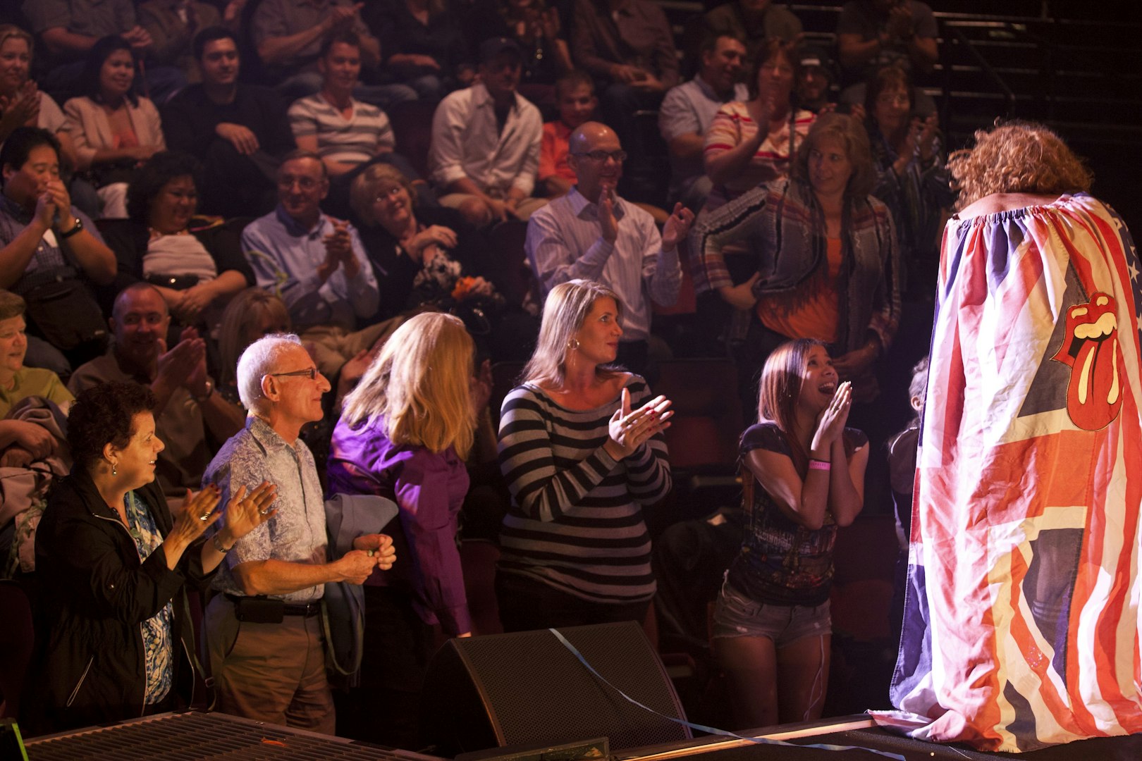 Audience applauding during Carrot Top performance in Vegas show.