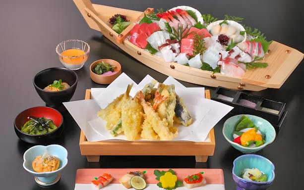 Traditional Japanese dinner with sushi and tempura on Tokyo Bay cruise.
