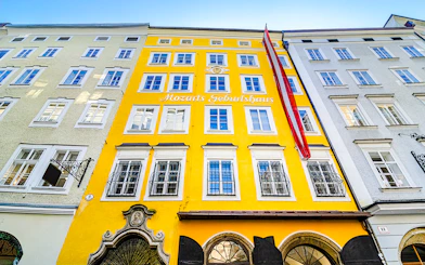 Birthplace of Mozart, yellow building facade in Salzburg, Austria.