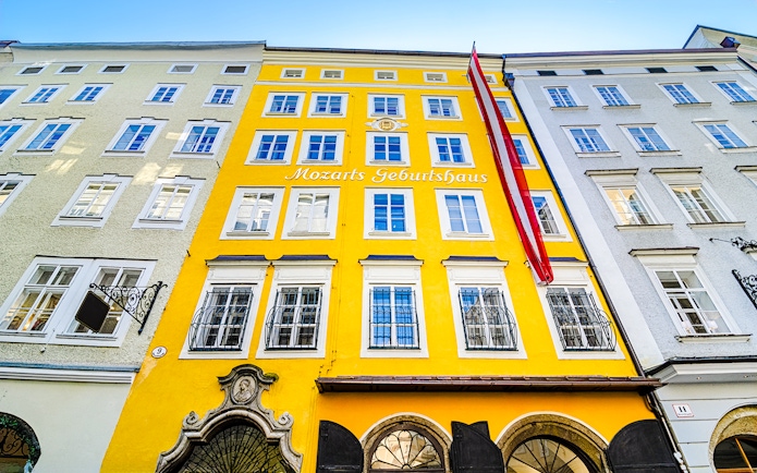 Birthplace of Mozart, yellow building facade in Salzburg, Austria.