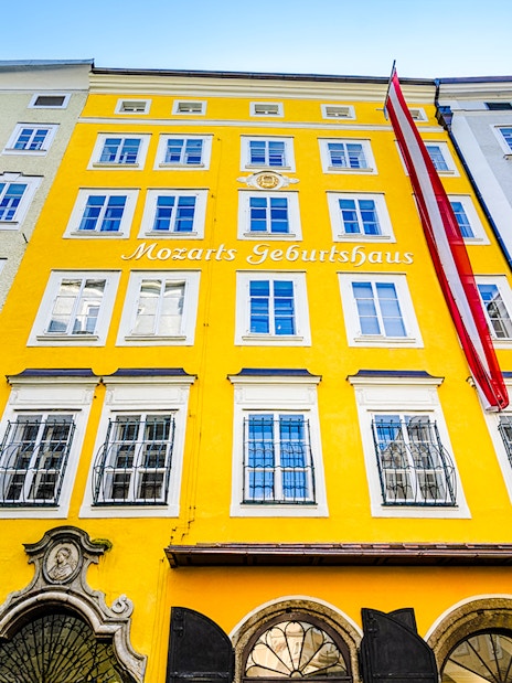 Birthplace of Mozart, yellow building facade in Salzburg, Austria.
