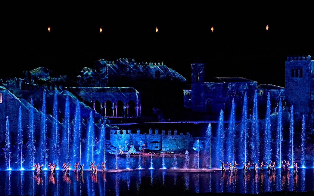 Dancers perform with illuminated fountains at The Dream of Toledo show in Spain.