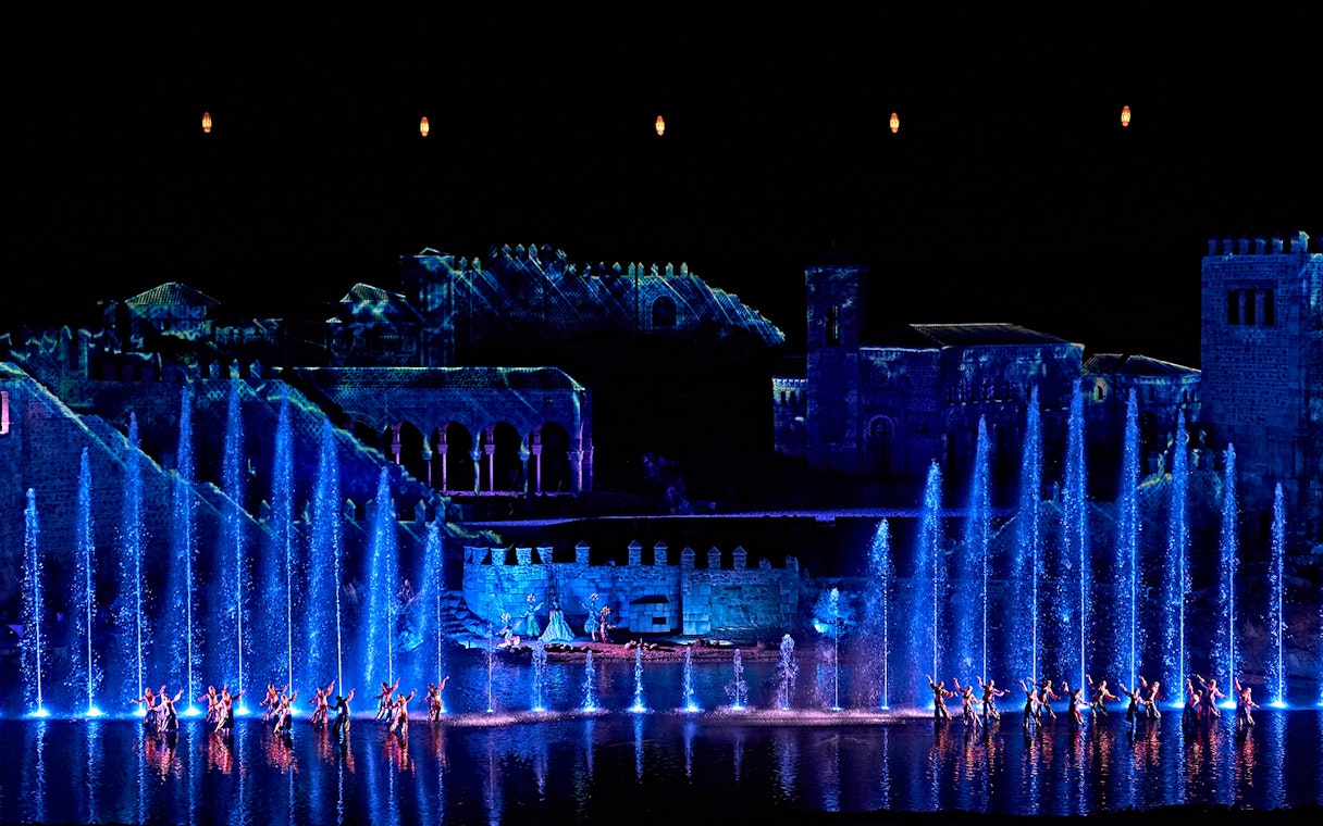 Dancers perform with illuminated fountains at The Dream of Toledo show in Spain.