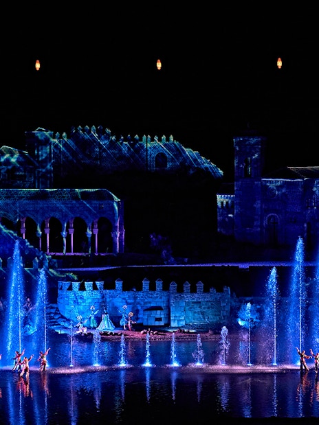 Dancers perform with illuminated fountains at The Dream of Toledo show in Spain.