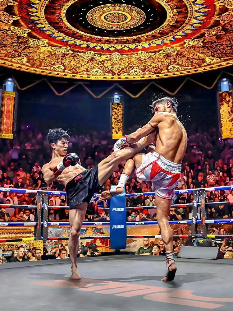 Muay Thai fighters in action at Rajadamnern Boxing Stadium, Bangkok.