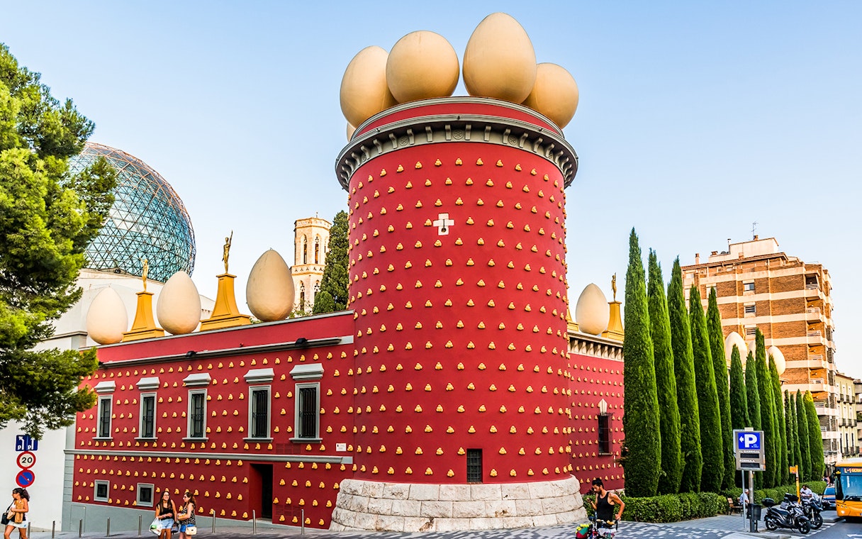 Dalí Theatre-Museum with egg sculptures on red facade in Figueres, Spain.