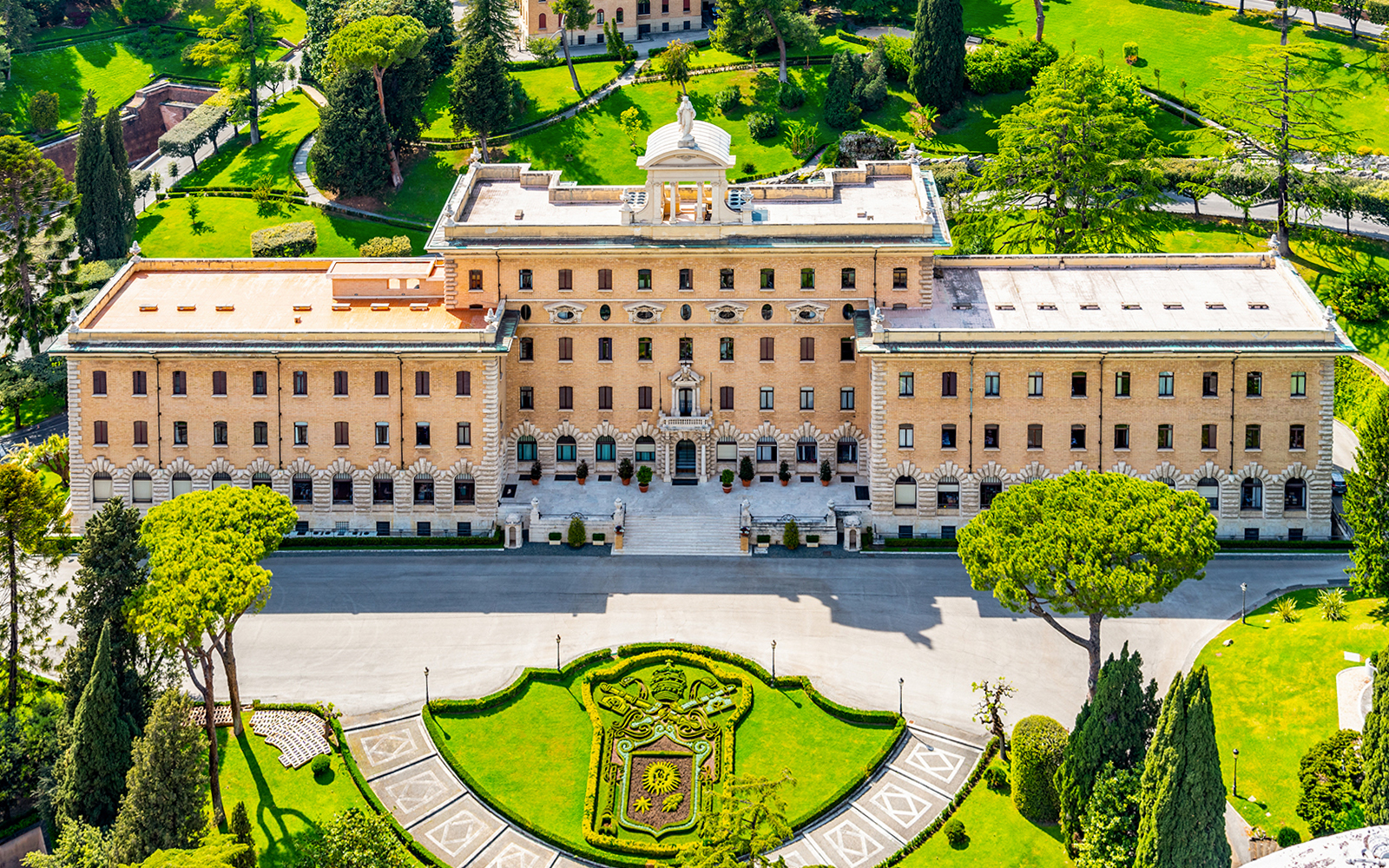 People gokarting in an indoor circuit.