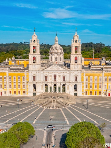 National Palace of Mafra facade with twin bell towers and central dome, Portugal.