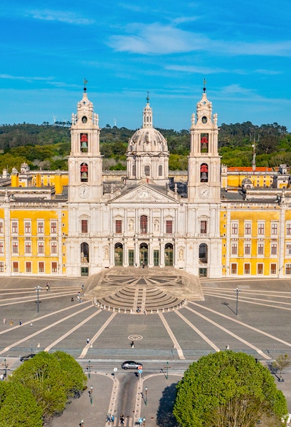 National Palace of Mafra facade with twin bell towers and central dome, Portugal.