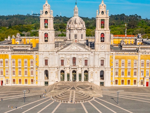 National Palace of Mafra facade with twin bell towers and central dome, Portugal.