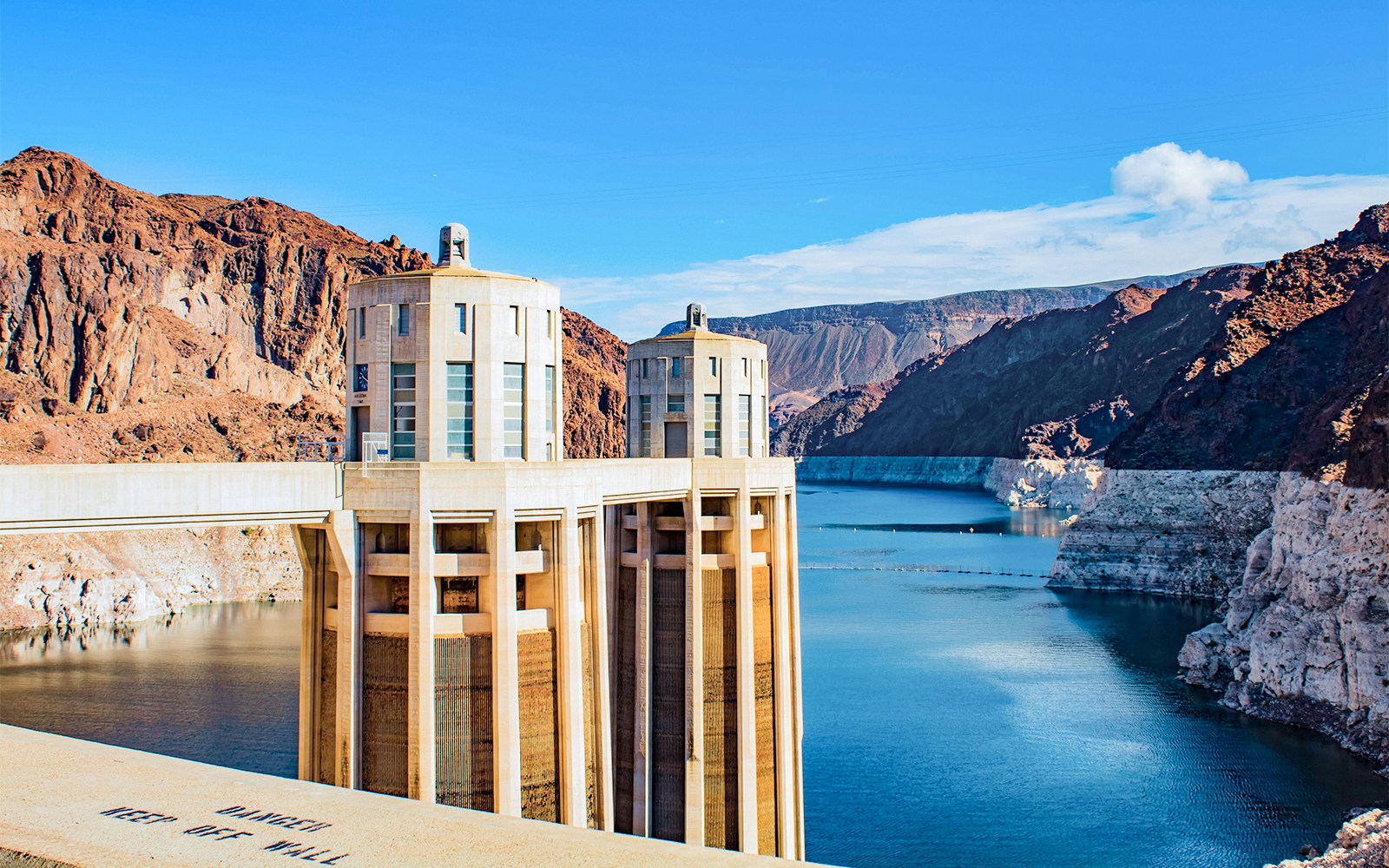 Hoover Dam towers and reservoir view from a scenic overlook.