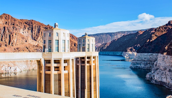 Hoover Dam towers and reservoir view from a scenic overlook.