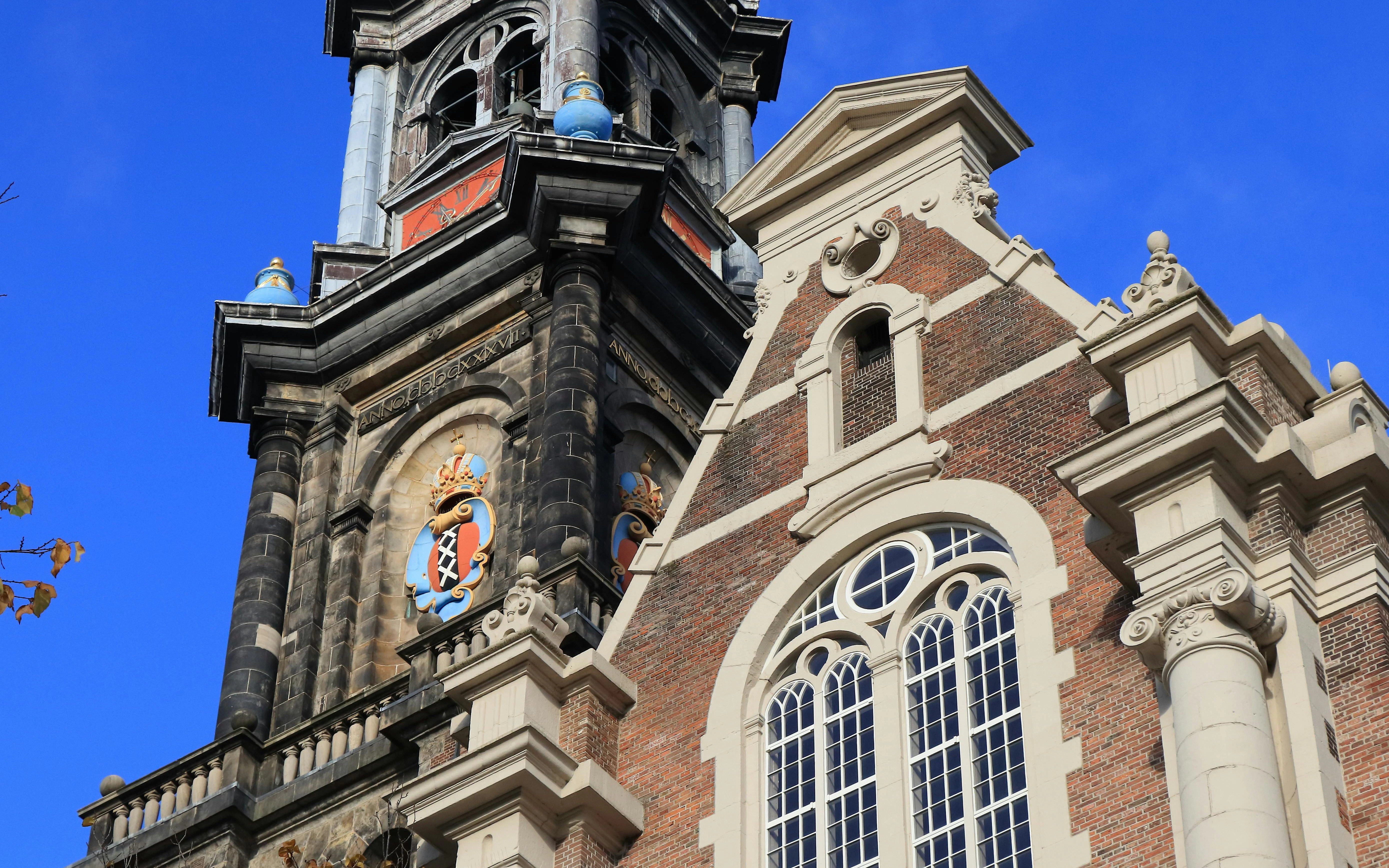 Westerkerk Church bell tower and window detail in Amsterdam, Netherlands.
