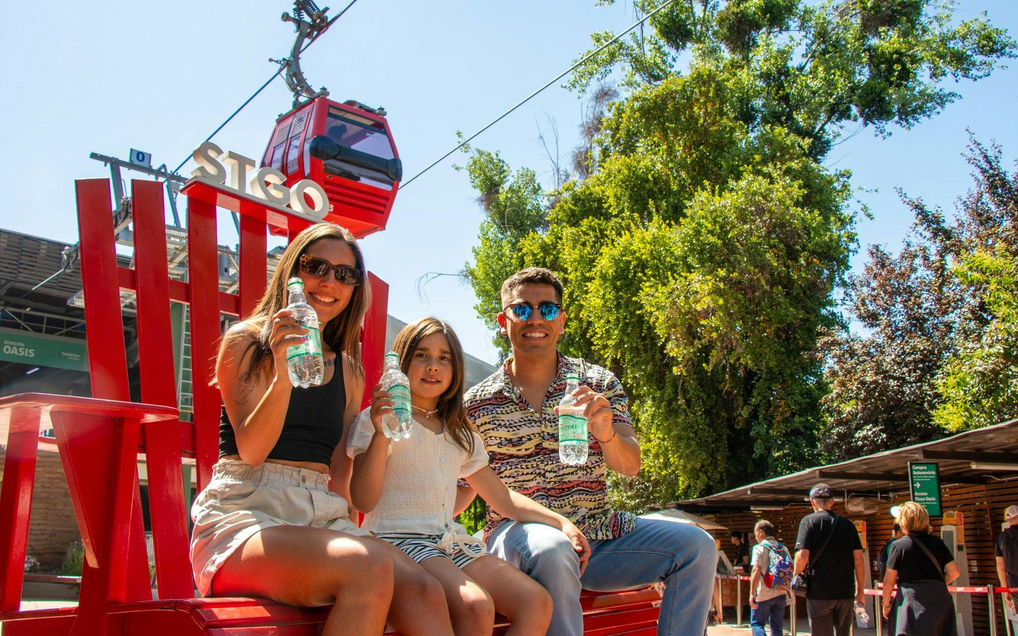 Family enjoying drinks near Santiago Teleférico in Metropolitan Park, Santiago.