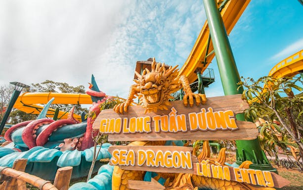 Sea Dragon sign with dragon sculpture at water park, Red River Tours 3 Island Hopping.