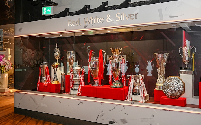 Trophies displayed at Liverpool FC Museum during stadium tour.