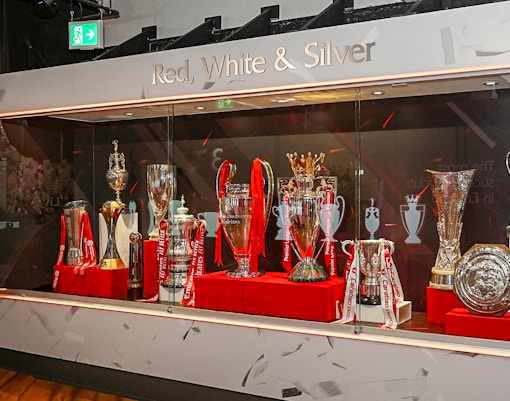 Trophies displayed at Liverpool FC Museum during stadium tour.