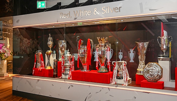 Trophies displayed at Liverpool FC Museum during stadium tour.