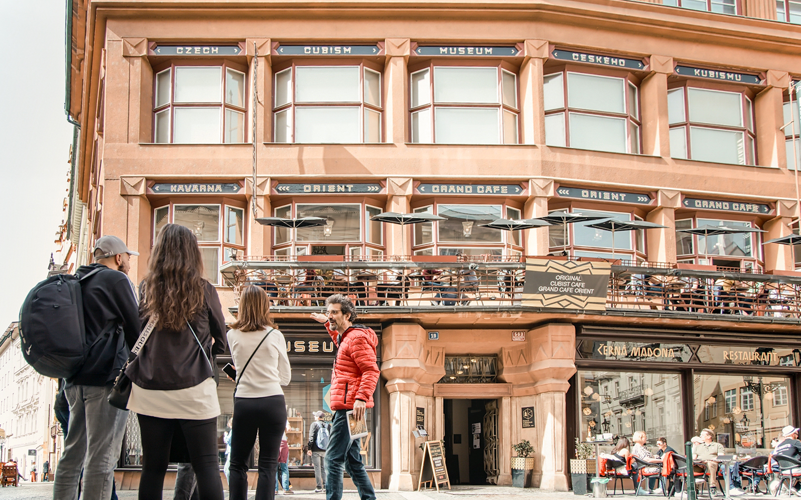 Tour group outside Grand Cafe Orient in Prague Old Town.