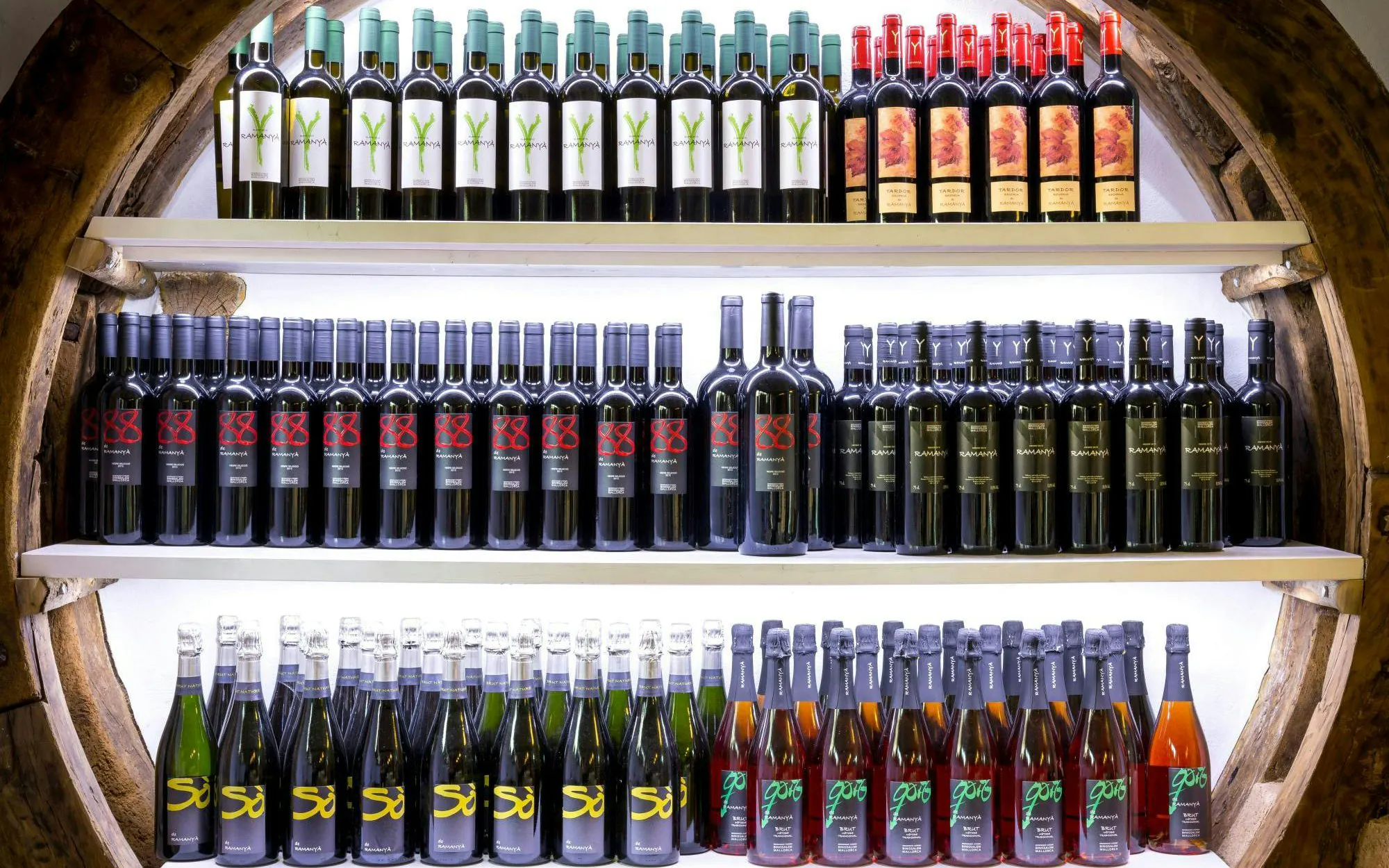 Bottles of wine displayed at Bodega Ramanya winery in Santa Maria del Camí, Mallorca, Spain.