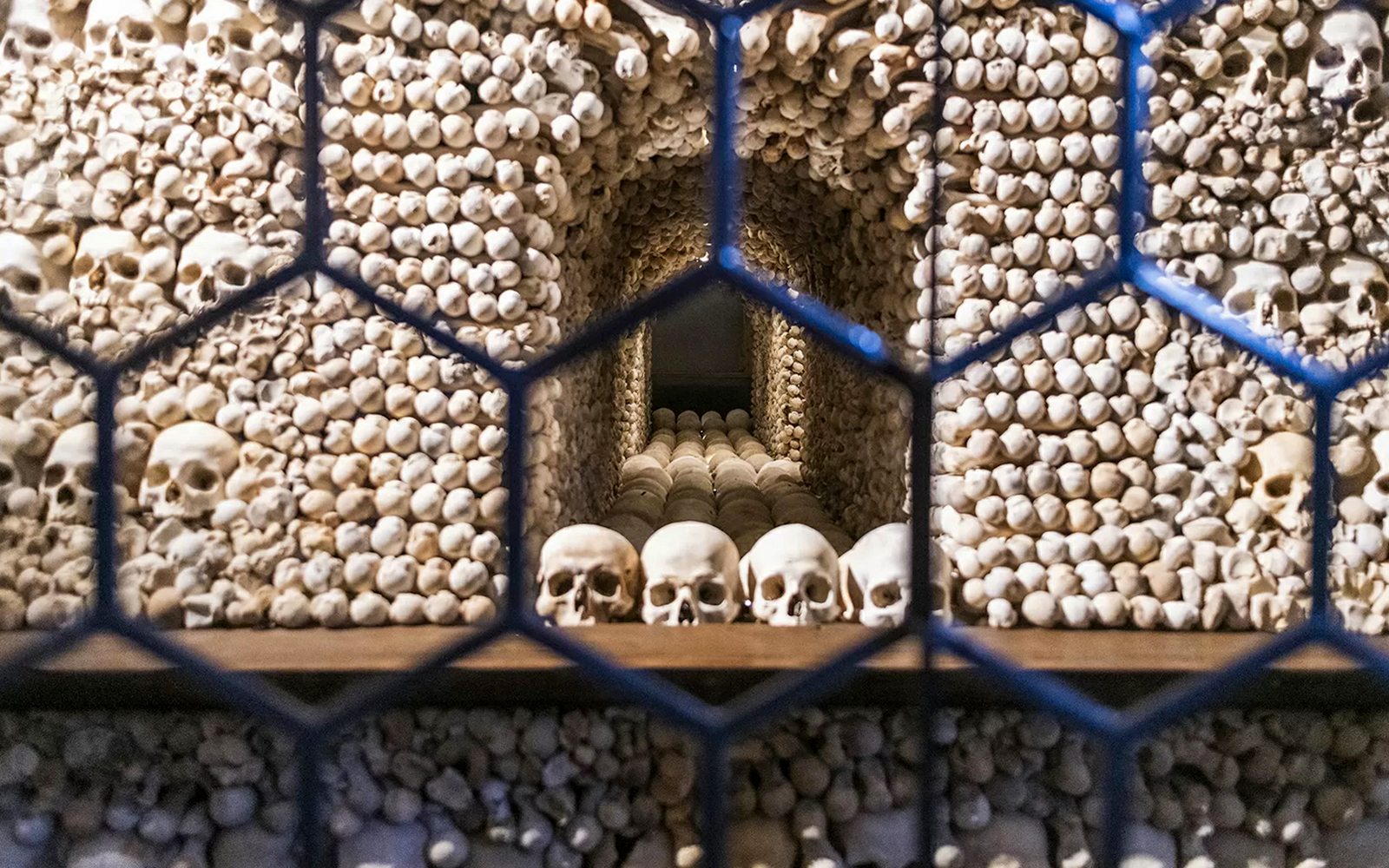 Bone skulls and skeletons arranged inside the Bone Church, Kutna Hora.