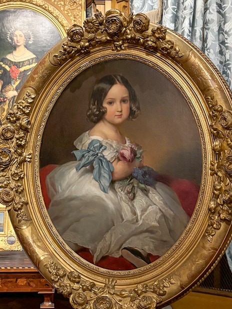 Miramare Castle paintings featuring portraits in ornate frames.