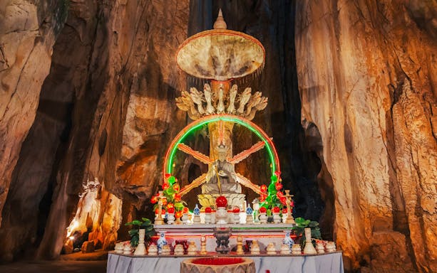 Altar with statue inside a cave at Sơn Trà Peninsula, Đà Nẵng, Vietnam.