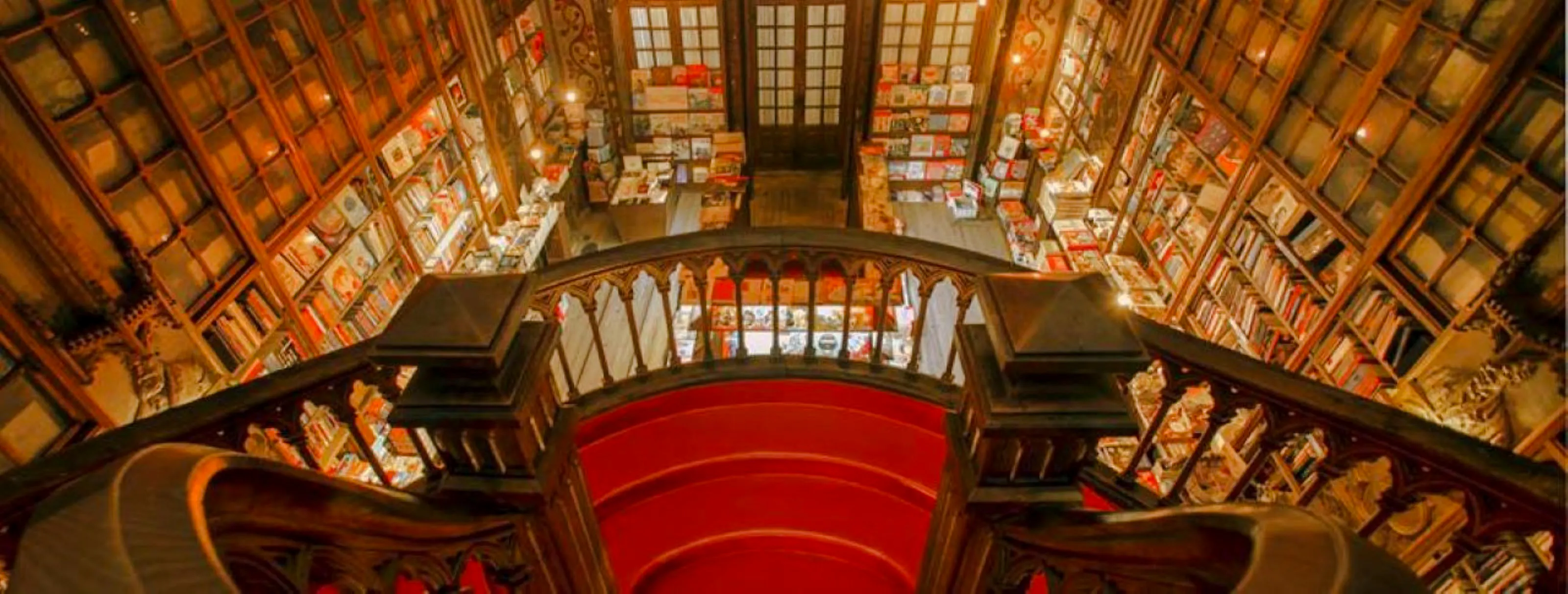Lello Bookstore's ornate staircase and bookshelves, Porto.