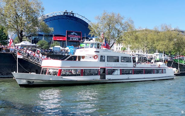 River cruise boat on the Rhine in Cologne near Old Town.