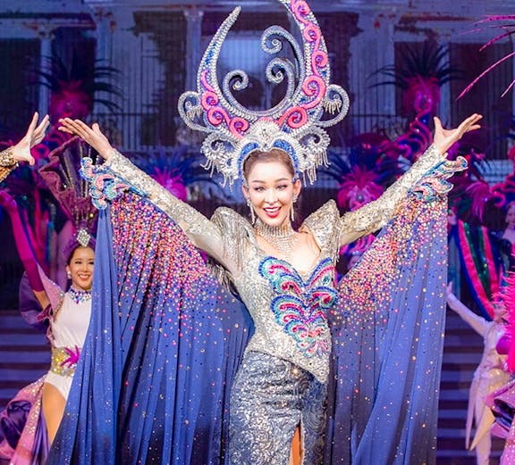Performer in elaborate costume at Tiffany's Show, Pattaya stage.