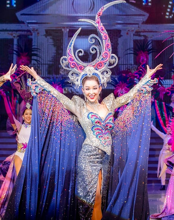 Performer in elaborate costume at Tiffany's Show, Pattaya stage.