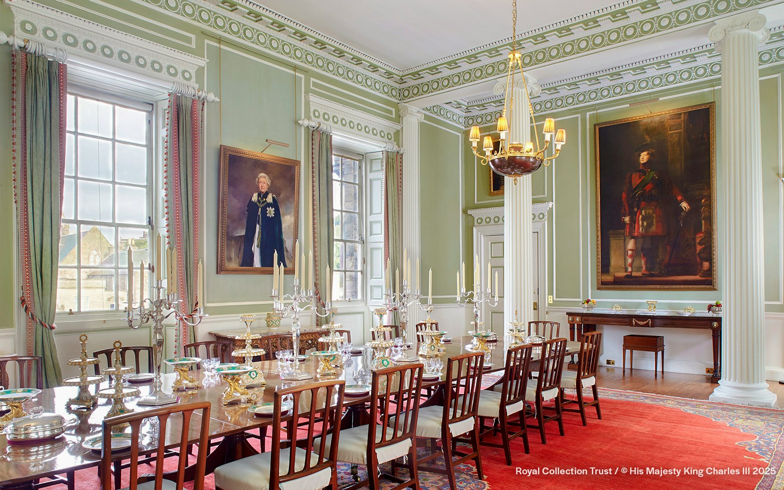 Royal Dining Room at the Palace of Holyroodhouse with ornate table settings and portraits.